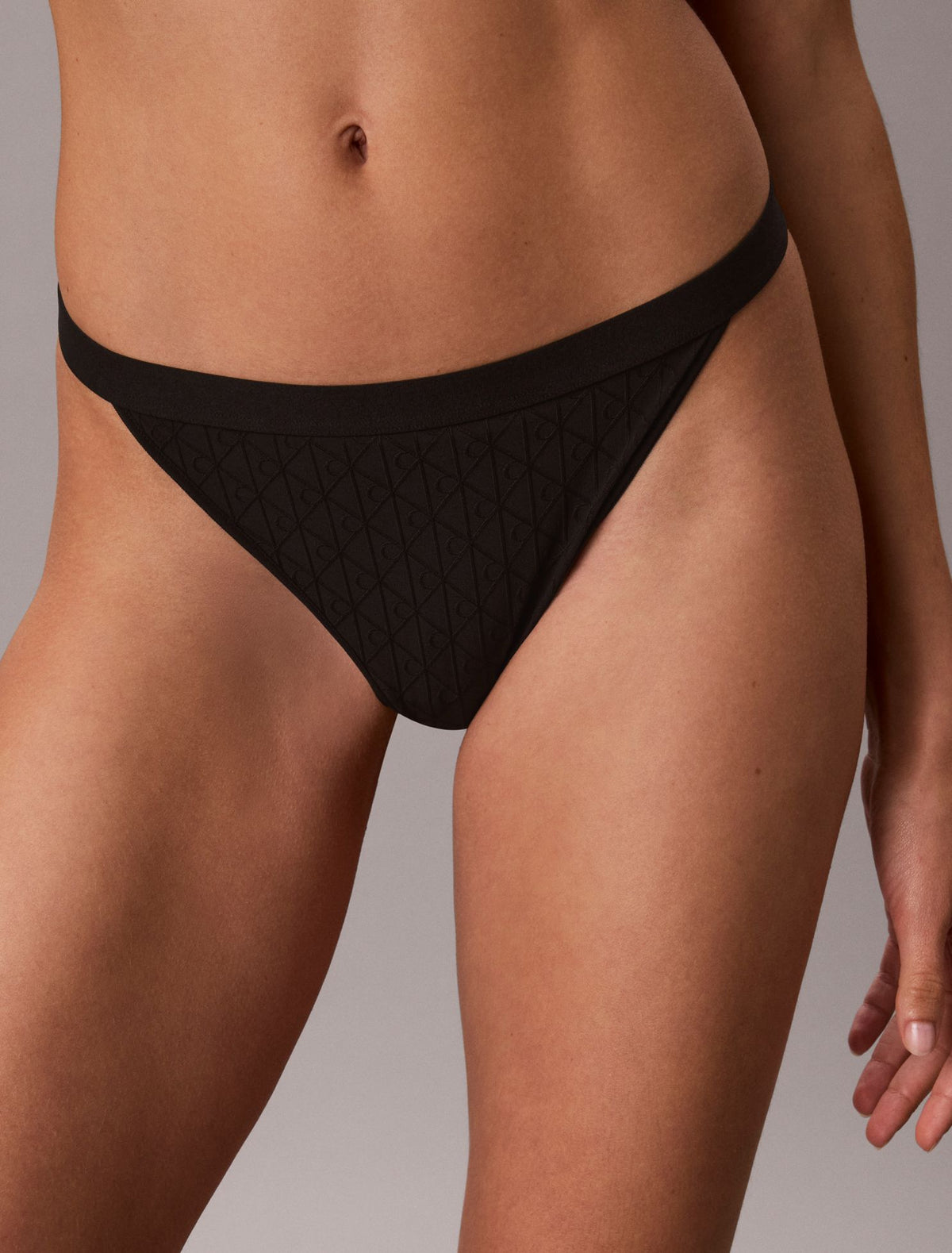Embossed Emblem String Thong - Calvin Klein Underwear